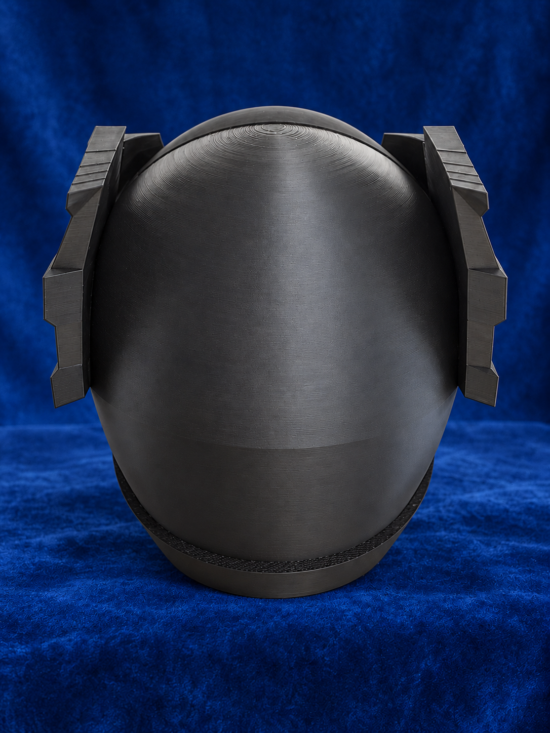 Psycho Ranger raw black PLA helmet kit on blue velvet, back view